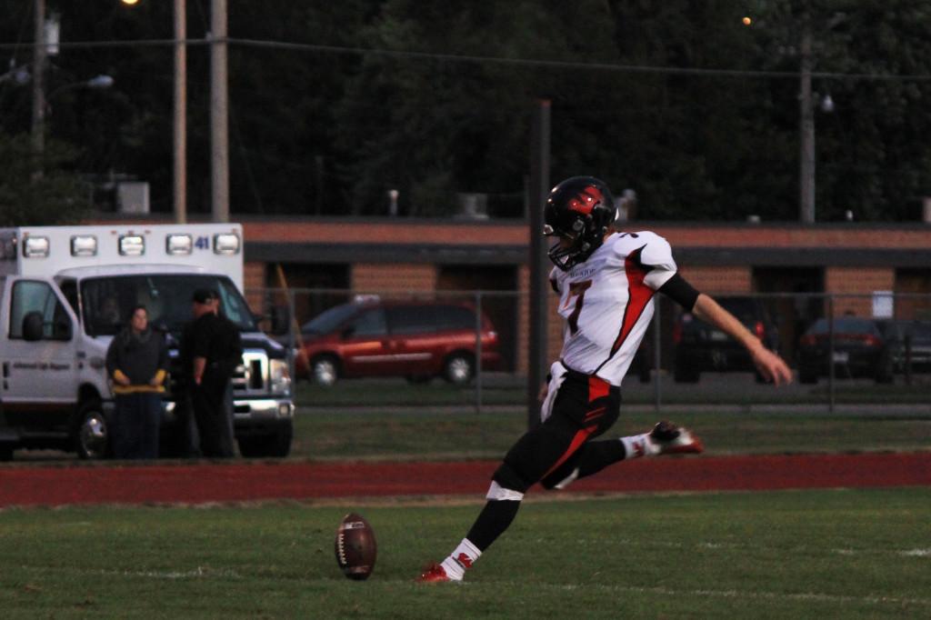 Senior kicker Christian Hagan kicks off during a Westside football game against Fremont _____. Hagan will be going to NIU on scholarship to kick.