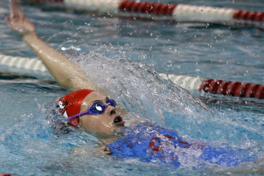 Sophomore Elizabeth Amato-Hanner swims back stroke. She made it to state her freshman year and is looking to qualify again this year. Photo by Emma Reilly