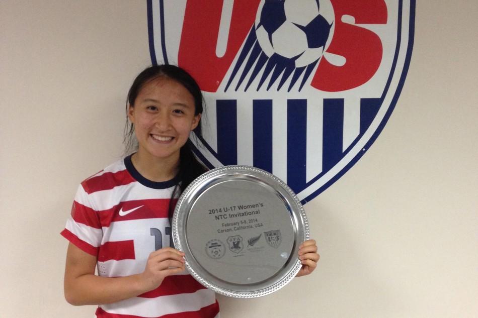Xiao poses with a trophy after a team USA win. Photo by Michelle Xiao