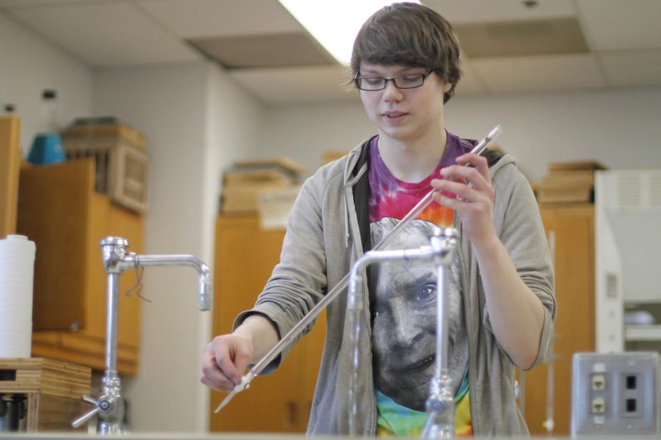 Senior Terry Edwards cleans a buret in the Honors Chemistry Lab at Westside. Edwards placed first in the chemistry lab competition at the Science Olympiad. Photo by Jakob Phillips