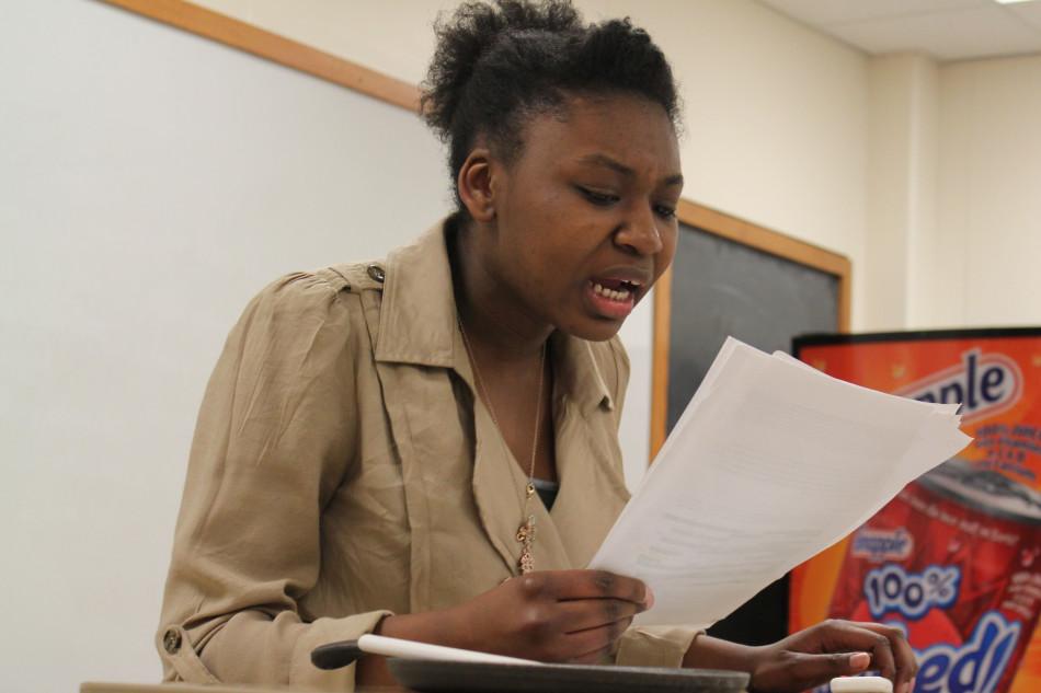 Senior Renee Stewart reads her affirmative at the national qualifying debate tournament, March 7 at Lincoln East High school. Policy debate team juniors Lia Hagen and Peyton Wells qualified for nationals, which is in Kansas City in June. Photo by Estella Fox 