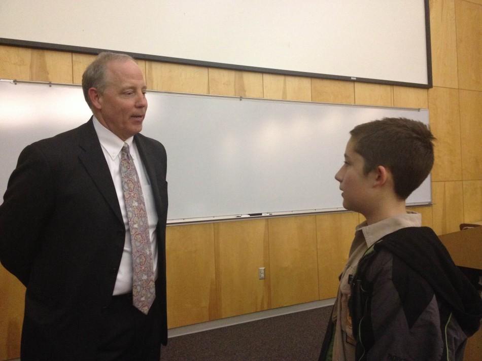 Superintendant Dr. Blane McCann talks to Oakdale sixth grader, Will Condon, after the Town Hall meeting, Thursday, April 3. Condon attended the meeting to achieve his citizenship in the community merit badge for Boyscouts, and his dad, an Oakdale parent, came to hear about the potential changes to his school and the district. 