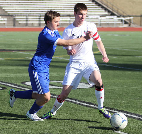 Senior Chase McCann tries to beat a Papio South defender. He had one goal in the game. 