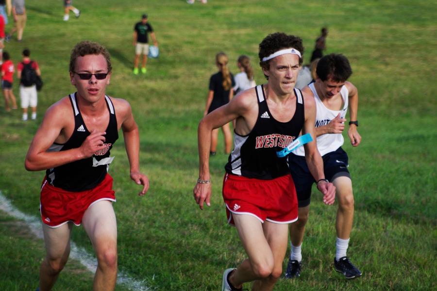 2014 Varsity Cross Country Runners Alec Reilly and Mitchell Coziahr run at the boys meet in Seward. The team won the overall meet, their first time ever.