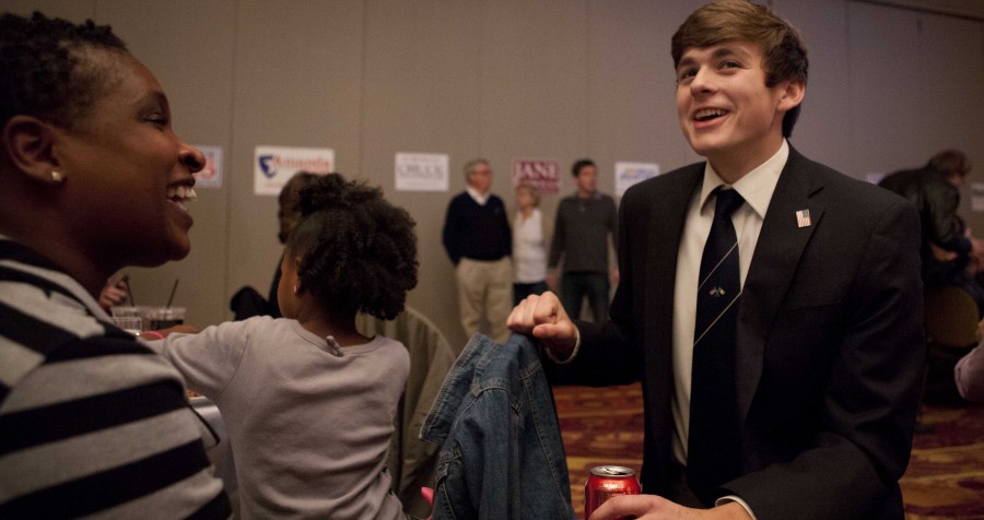 Senior Tom Ashford, son of congressional winner Brad Ashford, talks to supporter LaDonna
Gaines during the Democratic watch party at the Ramada Plaza Convention Center Tuesday,
Nov. 4. Tom is one of three children of Brad Ashford, a Westside alum. Photo by Sarah Lemke