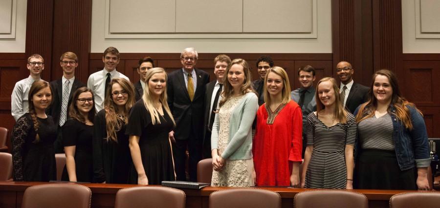 U.S. House Representative and Westside alum Brad Ashford poses with members of Westsides choir during the congressmans Omaha ceremonial swearing in Monday, Jan. 26. The choir performed two songs: America the Beautiful and Who Are the Brave. Photo by Sarah Lemke