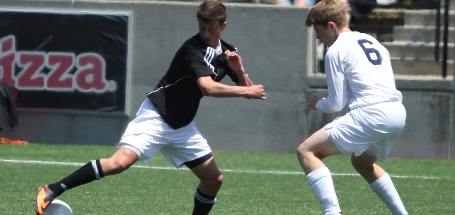 Then-junior Robert Wiseman dribbles the ball around a Creighton Prep defender during last seasons state tournament semifinal. Wiseman will be one of Westsides top players this season. Photo by Clair Selby