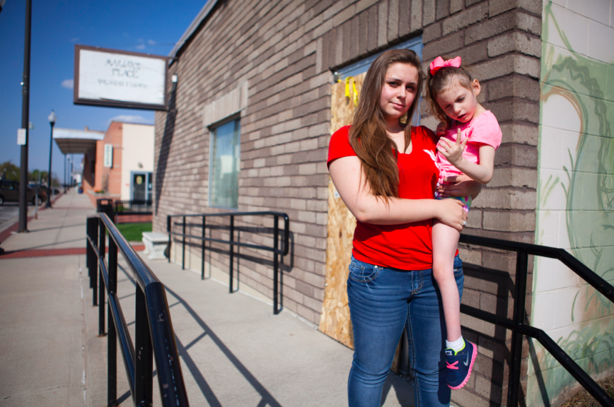 Junior Megan Stephenson and her sister Mariah visit her in front of their family restaurant, Mariahs Place, Tuesday, April 28.