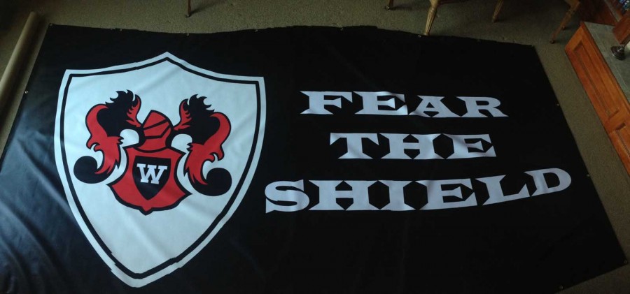 The new Red Shield banner that will be put up in the main gym for games.
