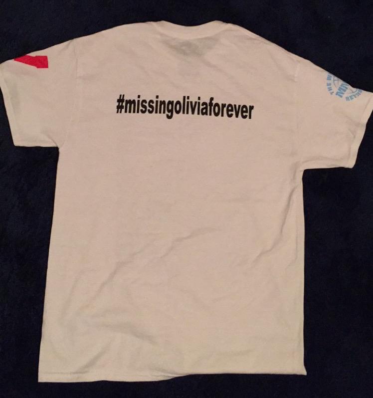 The back of the shirt has the hashtag #missingoliviaforever