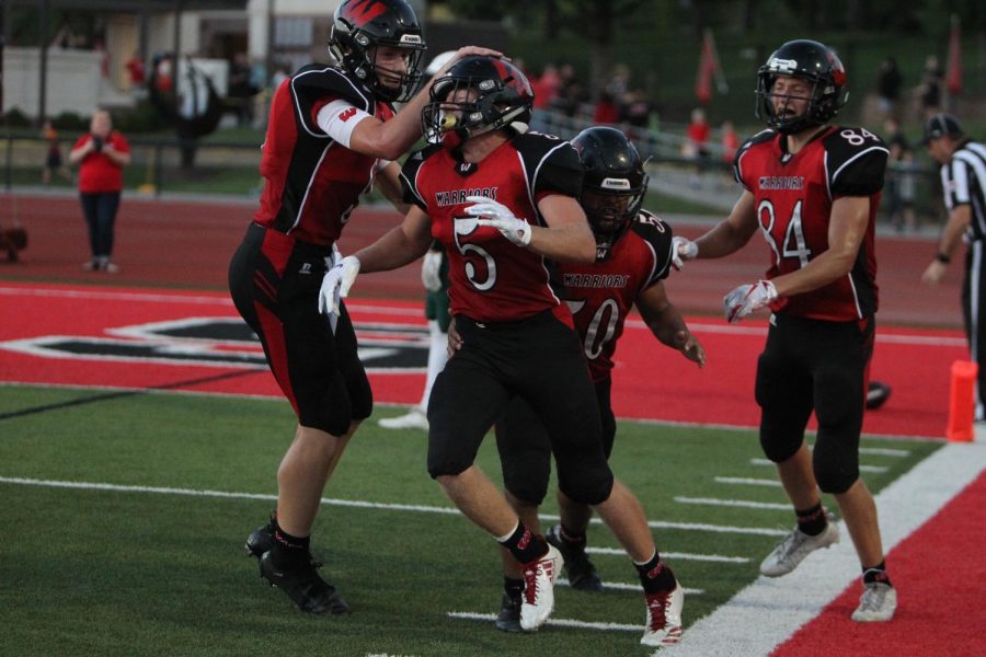 Senior Dylan Packett and his teammates celebrate a touchdown earlier in the season.