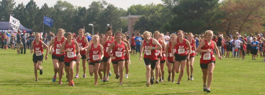 The Westside girls cross country team warms up for a meet earlier in the 2018 season.