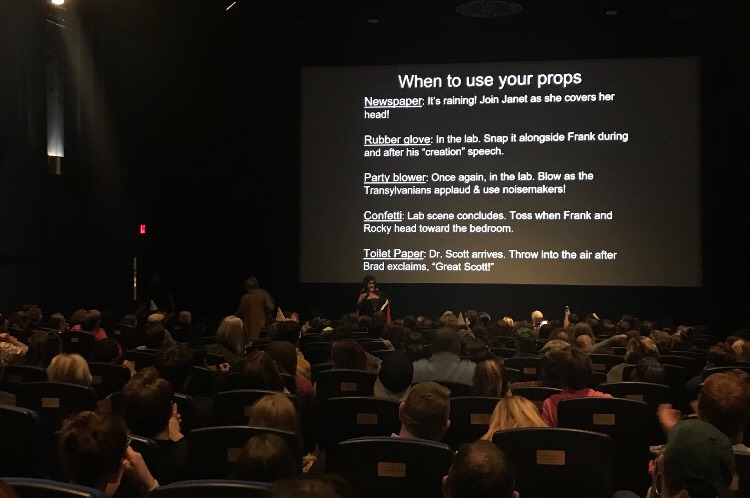 The audience at Dundee Theater learns how to use props for their screening of Rocky Horror Picture Show. 