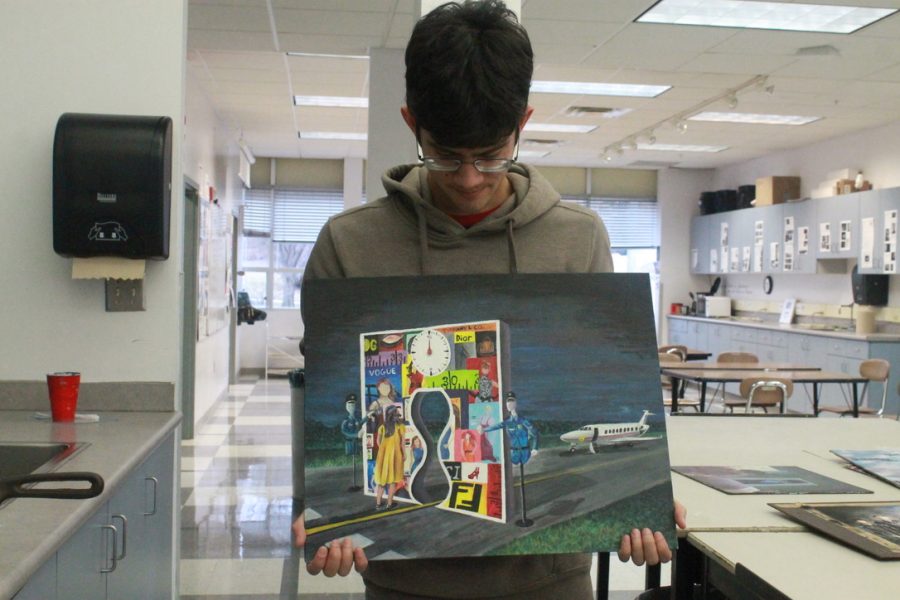 Art student Daniel Wood displays one of his award winning pieces.