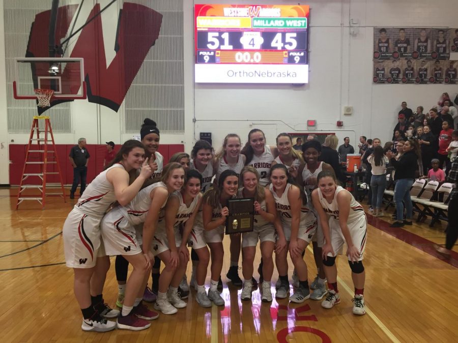 The girls received a plaque after winning the district A-5 title.
