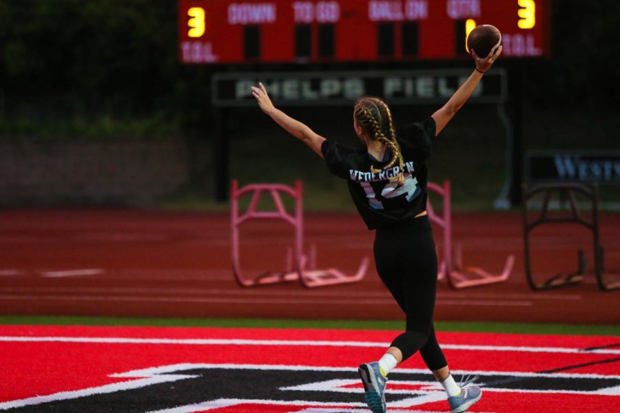 Senior Ella Wedergren scoring a touchdown during the 2019 Powderpuff game at Westside's Phelps Field.