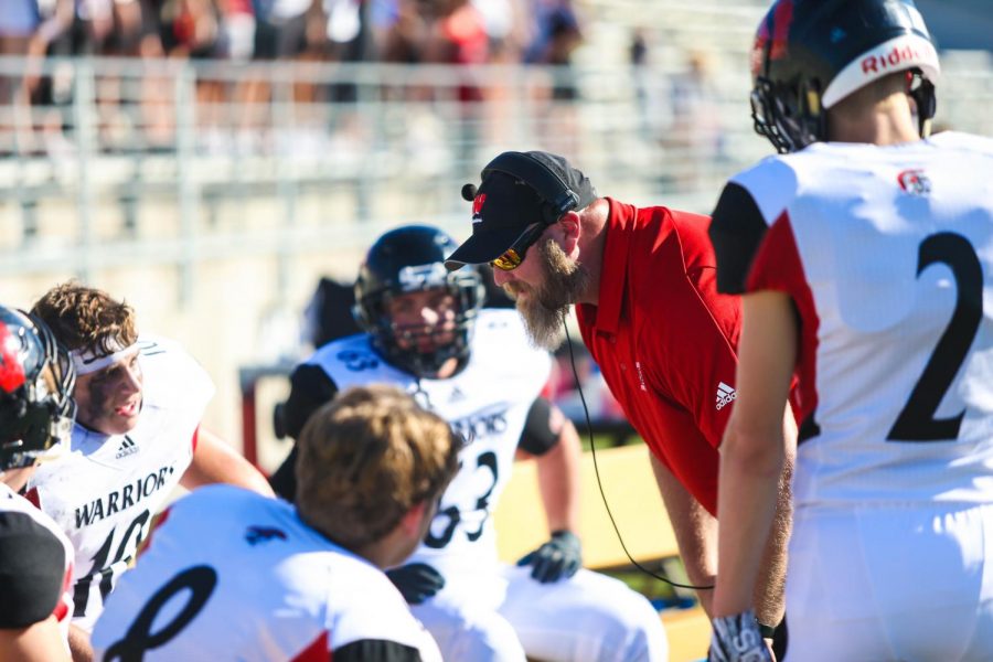 Defensive Coordinator Justin Haberman talks to his team when Westside travelled to Lincoln earlier this season.