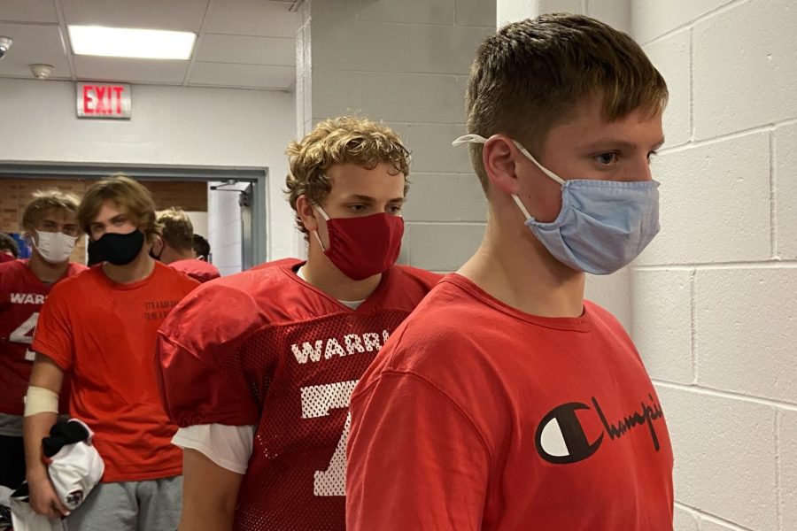 Westside football players wear masks during practices and games to prevent the spread of COVID-19.