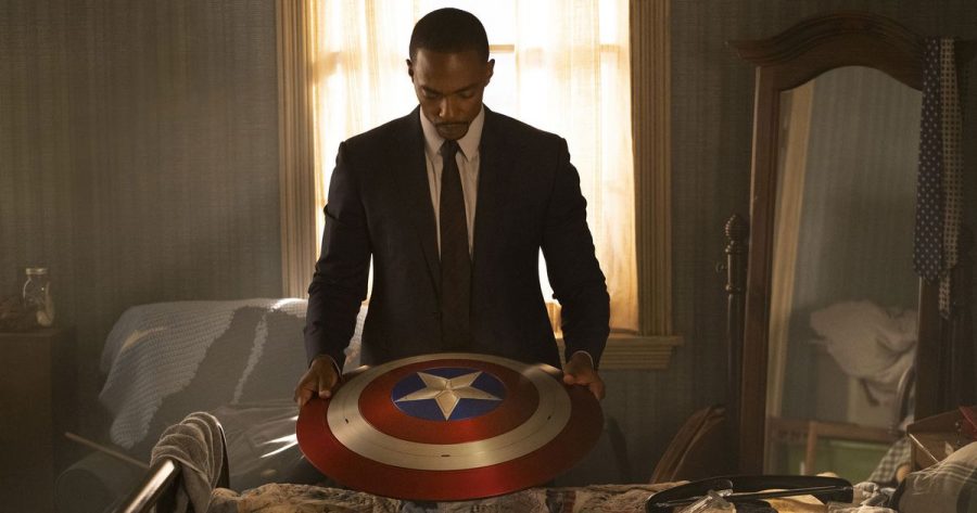 Sam (Mackie) preparing to return Caps shield to the government after turning down the offer to take up his mantle.
