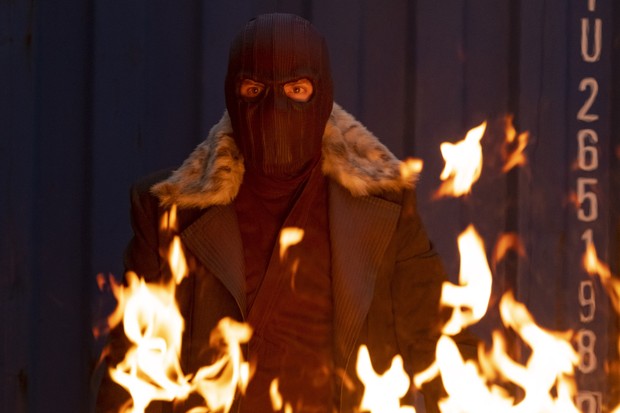 Zemo (Brühl) in his signature mask assisting Sam (Mackie), Bucky (Stan), and Sharon (VanCamp).
