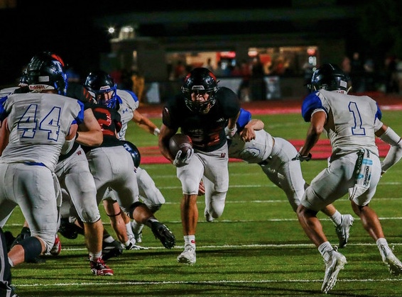 Dominic prepares for two tackle attempts from Papio South defenders. Rezac would break three tackles on this play and run in for his third touchdown on the night in the third quarter. Photo by Zoe Gillespie