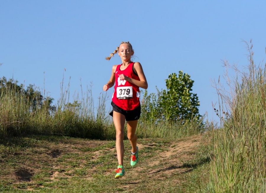 Sophomore Claire White runs in the Class of Metro meet. White placed first among her class. Photo by Eliza Haney