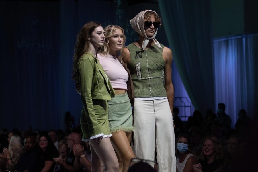 Nelson poses with models all wearing items from her collection För Välden at Omaha Fashion Week.
