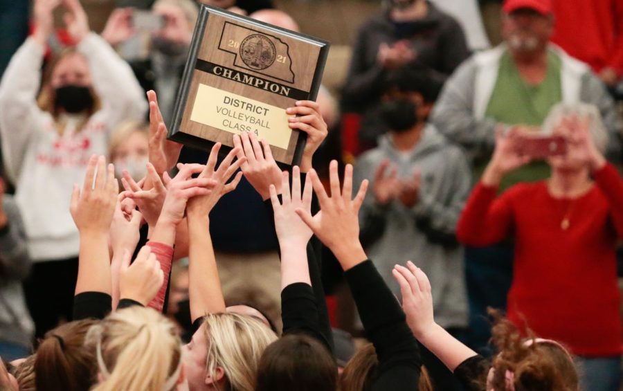 Westside+volleyball+holding+the+A-7+District+Plaque+after+their+win+against+Fremont.+The+Warriors+are+headed+to+the+state+tournament+for+the+first+time+since+2002+-+Photo+by+Mary+Nilius+