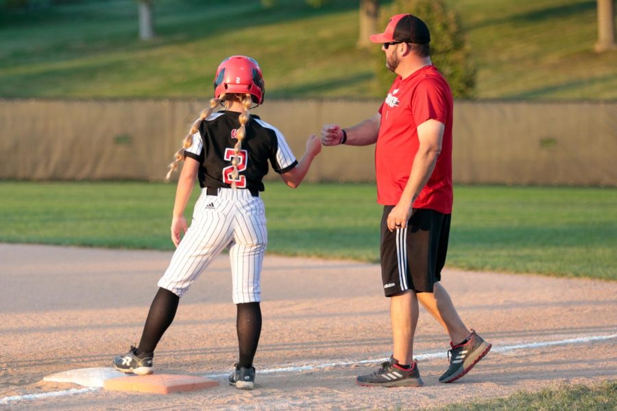 Second Baseman JaLee Conyers stands on first after her first single of the night against Gretna. - Photo by Zoe Gillespie