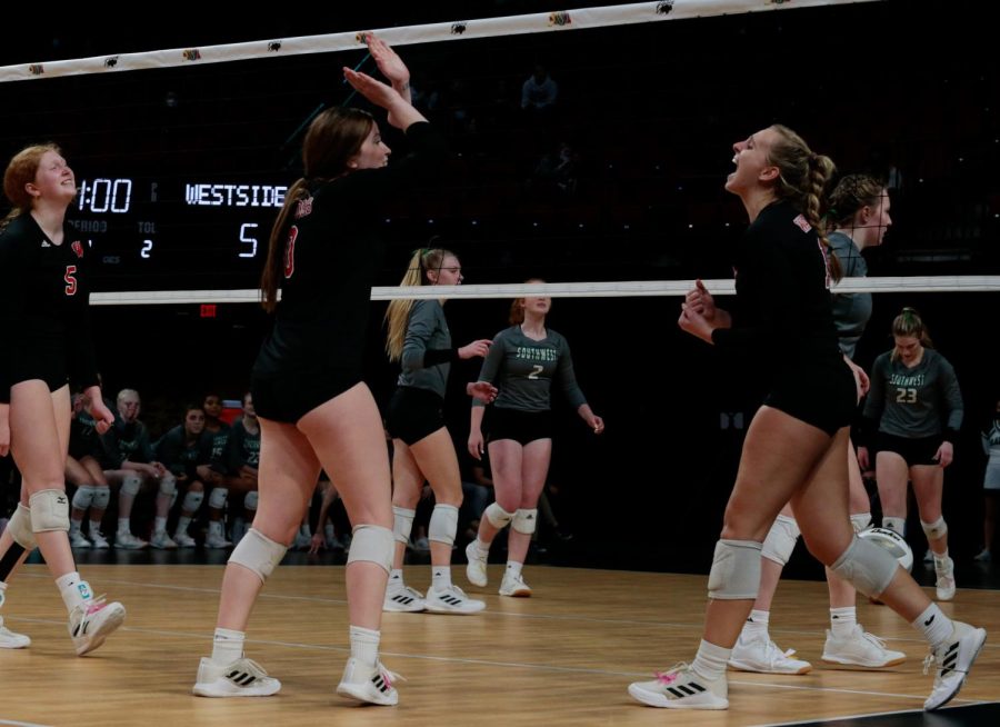 Montana State volleyball commit Madilyn Siebler celebrates to her teammate junior Jocelyn Healy after a point against Lincoln Southwest - Photo by Zoe Gillespie