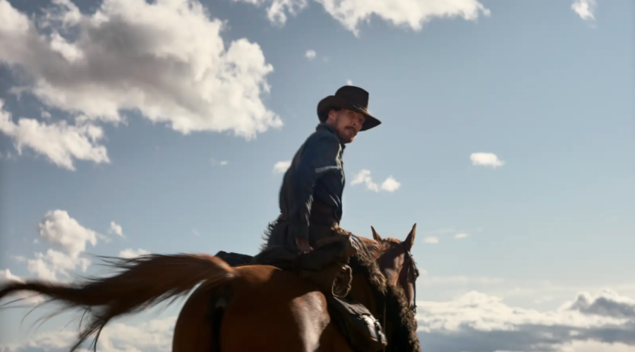 Phil Burbank (Cumberbatch) riding a horse on his ranch.