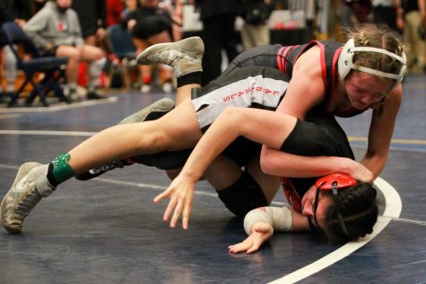Regan Rosseter competes in the 2021 NSWCA Girls Wrestling State Championships in York, Nebraska. She would take home the 124 lb weight class title - Photo by Jaden Taylor