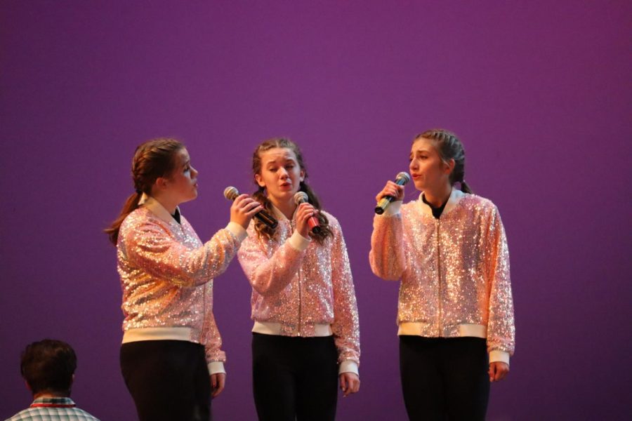 Sophomores Theresa Bochnicek, Mia Rasgochek and Greta Mann perform their trio.