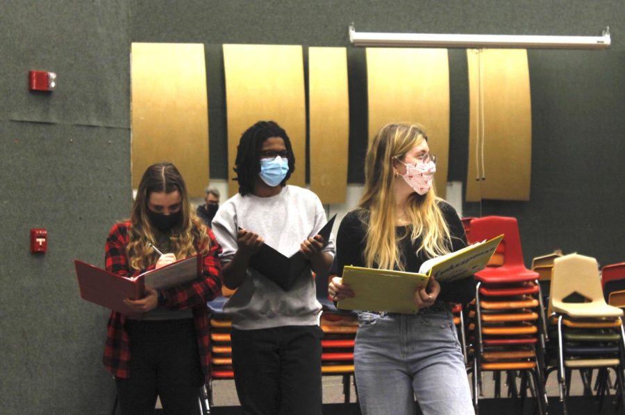 Junior Meg Parsonage (left), playing Kit Marlowe, seniors Jalen Johnson (middle), playing Richard Burbage, and Zola Madson (right), stage manager.