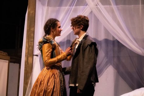 Senior Ava Van Gelder as Viola de Lesseps and James Watke-Stacy as William Shakespeare recite an excerpt from Romeo and Juliet.