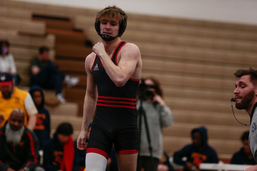 Noah+Aken+ended+his+career+as+a+medalist+in+the+145-pound+class.+Aken+here+walks+back+after+winning+his+match+in+the+Westside-Papio+South-Omaha+Northwest+triangular