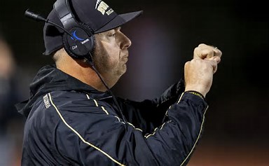 Coach Limongi works with his team at Omaha Burke. Photo credit: Omaha World Herald