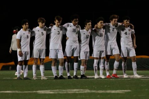 Westside’s boys soccer starting lineup stands next to each other prior to their game against Omaha Bryan in 2021