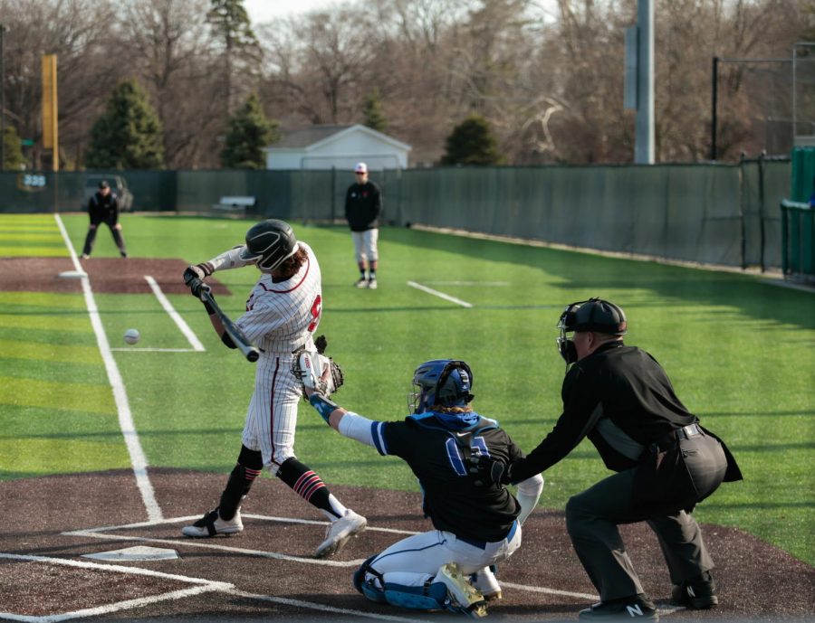 Senior+Dalton+Bargo+%28left%29+laces+a+double+down+the+left+field+line+against+Creighton+Prep.+Bargo+would+go+2-3+on+the+night+and+currently+leads+Class+A+in+batting+average.
