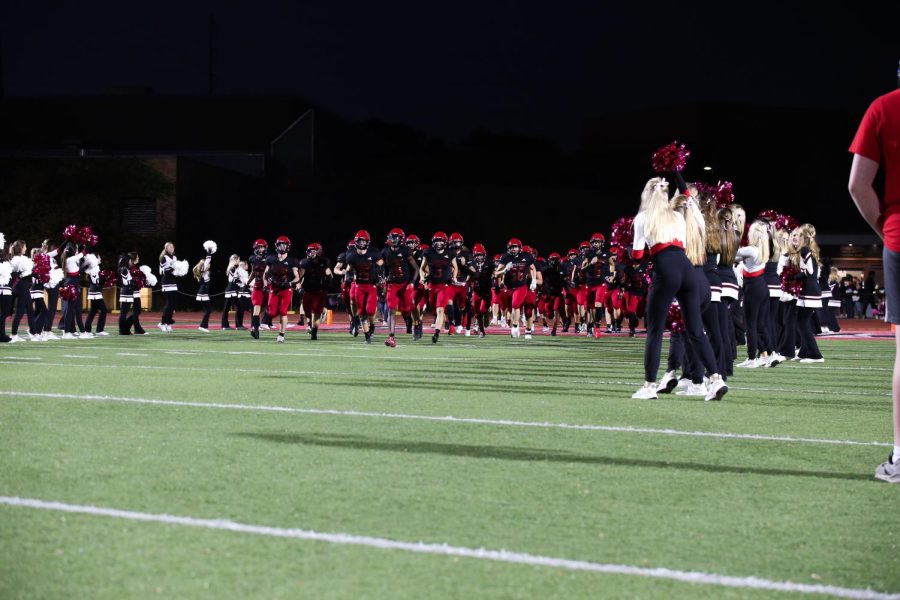 The football team takes the field for the first round of the playoffs. The Warriors were victorious over Papio.