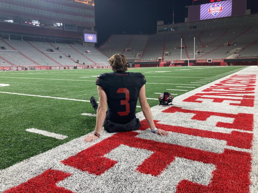 Kicker Tristan Alvano reflects on the field after the state championship.  Alvano kicked a last second field goal to seal the win.