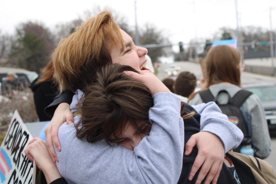 Slanec embraces a friend at the conclusion of the protest across the street from Westside High School
