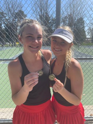 Sophomore Grace Greenwald and junior Ava Schroeder show off their first place medals at the Kearney Doubles Invite on April 13.
