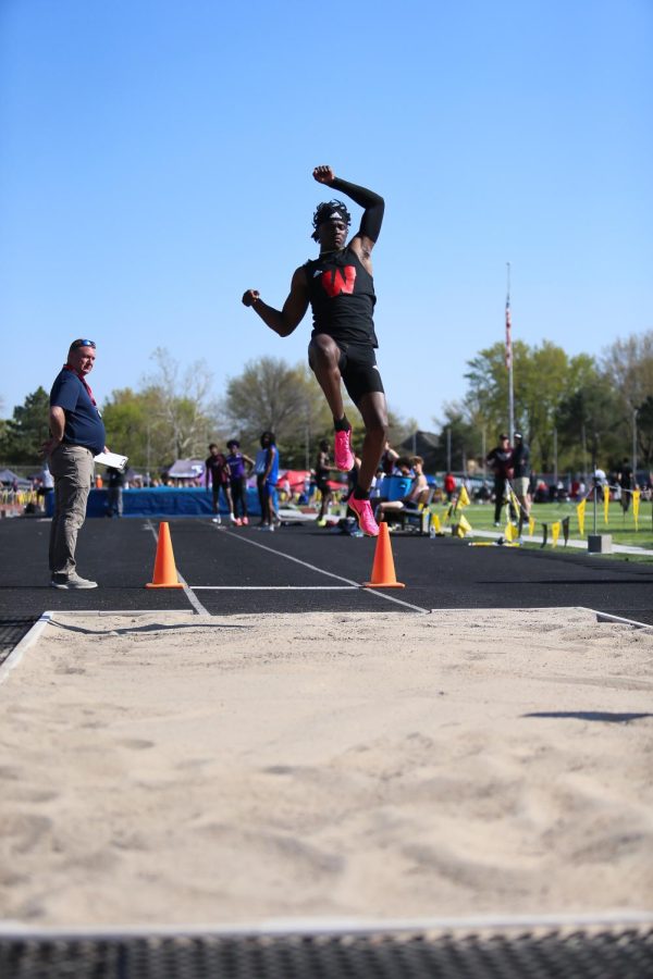 Senior Jaylen Lloyd competes in the long jump.